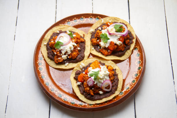 istock picadillo corn tostadas with cheese and beans. Mexican food 1400865174