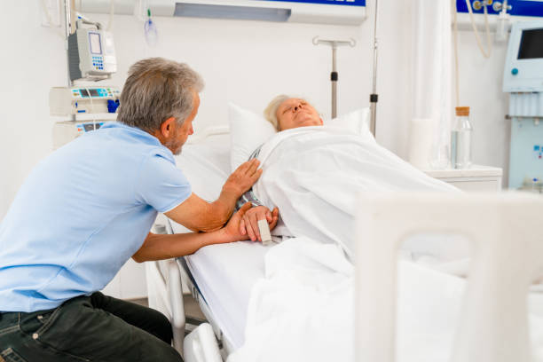 istock husband holding wife's hand at the hospital 1400865372
