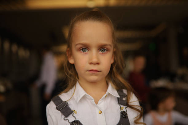 Close-up of a shy child