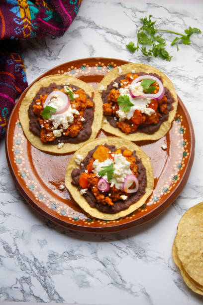 istock picadillo corn tostadas with cheese and beans. Mexican food 1400865541