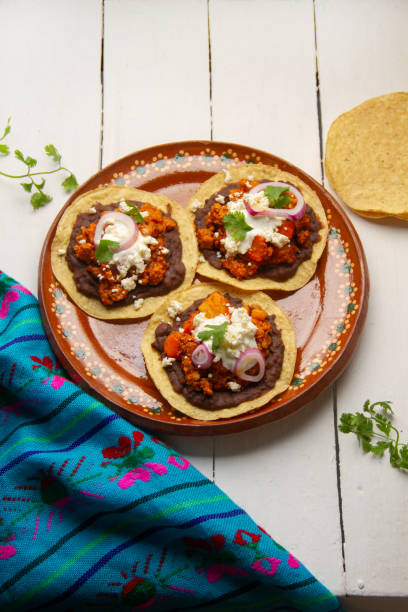 istock picadillo corn tostadas with cheese and beans. Mexican food 1400865660