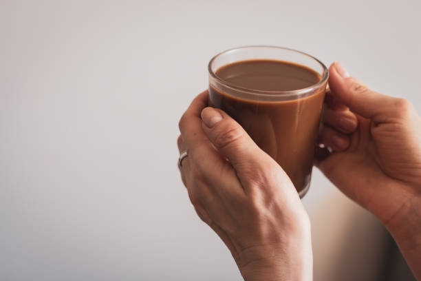 Girl holding coffee cup. Hands holding cup of morning coffee. Latte in cafe. Cappuccino cup. Espresso with milk. Hot drinks. Relax with coffee. Breakfast concept.