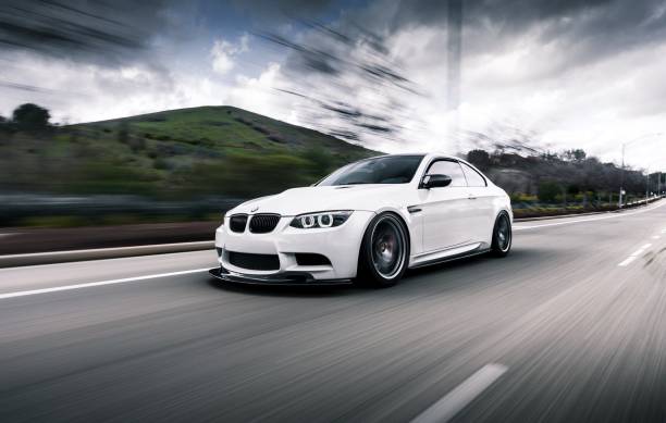 BMW E92 M3 LA, CA, USA
4/3/2022
White BMW E92 M3 driving on the road with a green mountain in the background bmw stock pictures, royalty-free photos & images