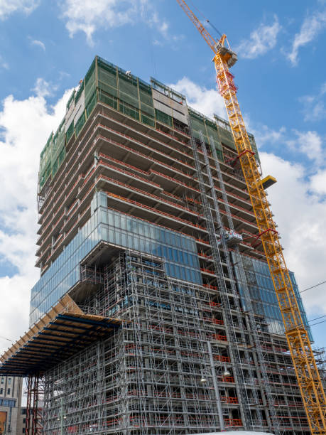 istock Construction. Tower crane at the construction site of a high-rise building. 1400879550