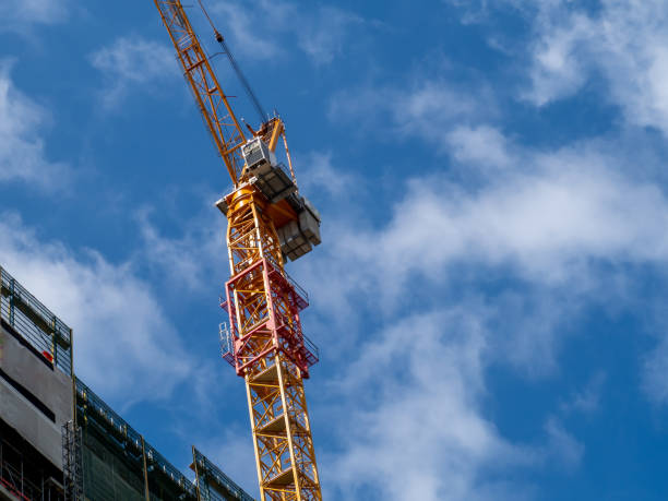 istock Construction. Tower crane at the construction site of a high-rise building. 1400879552