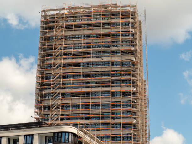 istock Construction. Tower crane at the construction site of a high-rise building. 1400879640