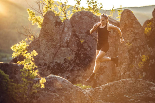 istock Strong woman running on mountain 1400879675