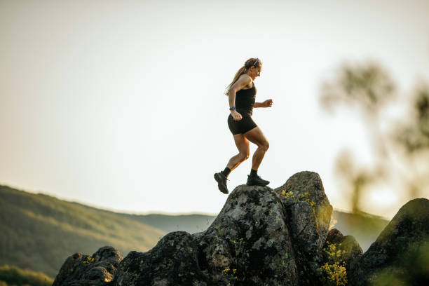 istock Strong woman running on mountain 1400880208