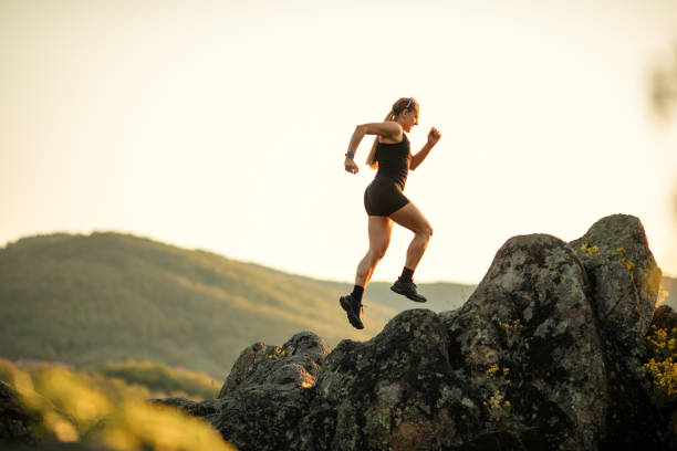 istock Strong woman running on mountain 1400880211