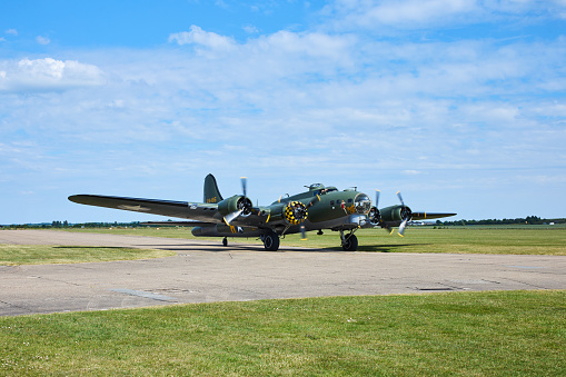 A Boeing B-17G (G-BEDF, Sally B) taxiing to take off at Duxford.