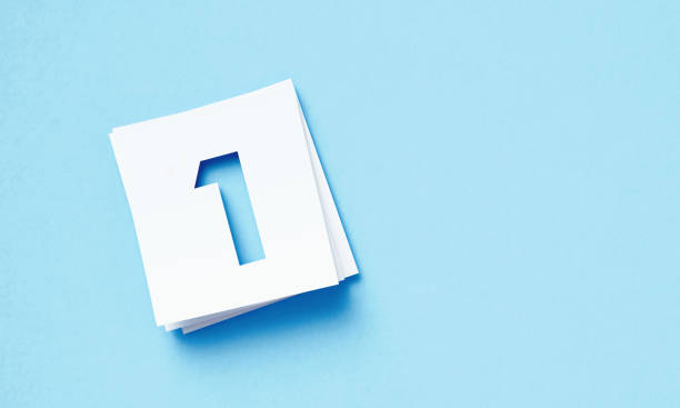 istock White Adhesive Notes With Cutout Number 1 Sitting Over Blue Background 1400880357