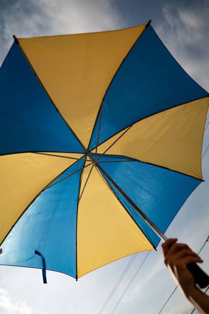 istock Blue and Yellow Umbrella 1400881414