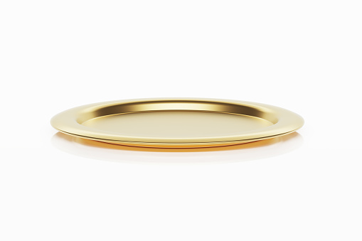 Gold platter sitting on white background. Horizontal composition with copy space. Clipping path is included.