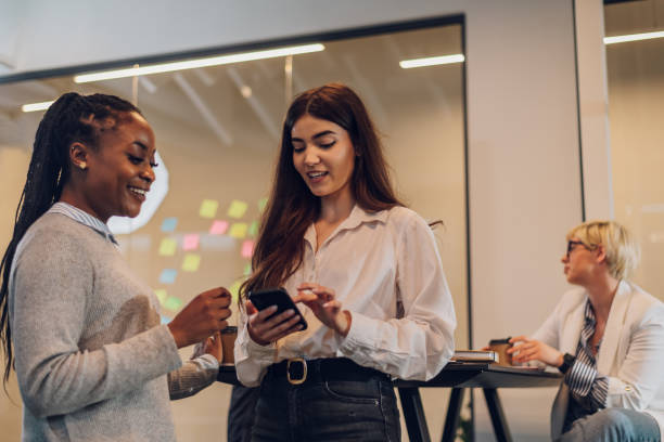 istock Two multiracial business colleagues working together in the office 1400882211