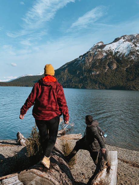 istock Couple watching the lake under the mountains 1400882961