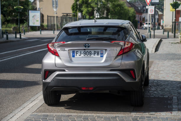 Rear view of grey Toyota C-hr hybrid parked in the street stock photo