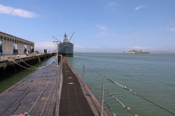San Francisco, United States - October 6, 2017:  United States Navy servicemen and United States marines standing along the perimeter of the USS Essex in the Parade of Ships during Fleet Week 2017 in San Francisco Bay.