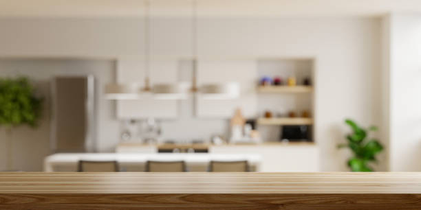 istock Wooden table top on blur kitchen room background,Modern Contemporary kitchen room interior. 1400900961