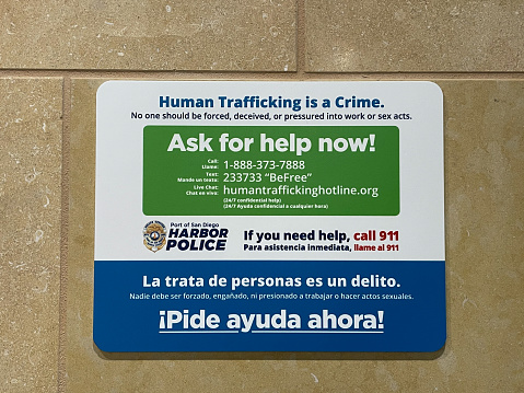 San Diego, California - November 27th, 2020: A human trafficking sign at San Diego International Airport. Human trafficking has become a major concern of airport security.