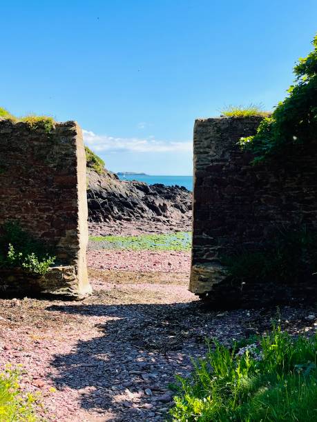 Monk Haven Pembrokeshire Overlooking Monk Haven Bay in West Wales - a door to another world.  A doorway into a tranquil, isolated beach milford haven stock pictures, royalty-free photos & images