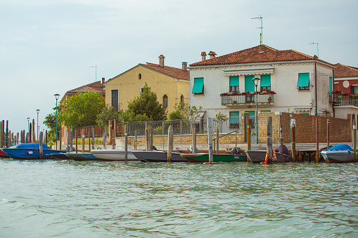 Murano Island, Venezia, Italy - July 06, 2019: Streets and canals of Murano Island known for its glass-making tradition.