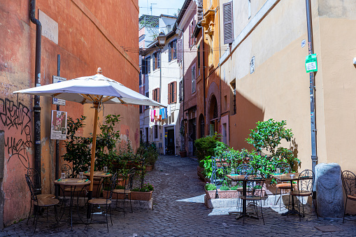 Trastevere, Rome, Italy - July 04, 2019: Charming and colorful streets of Trastevere in Rome.