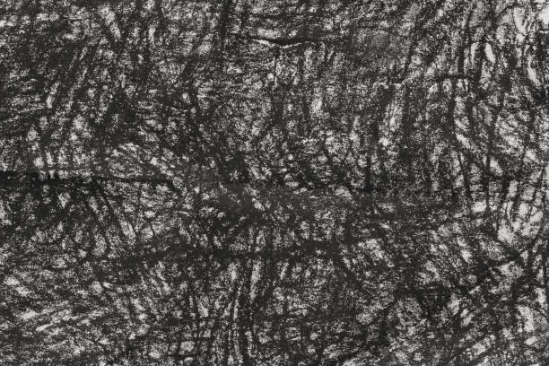 charcoal doodles on gray paper background texture