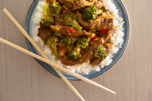 istock Chinese Beef and Lemon Broccoli  with rice and chop sticks 1400924544