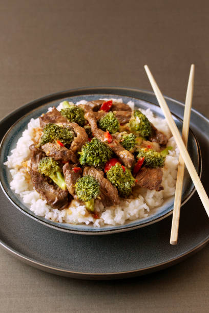 istock Chinese Beef and Lemon Broccoli  with rice and chop sticks 1400924557