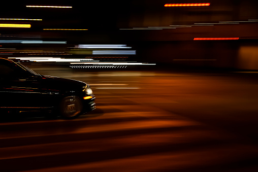 Blurred motion: Black car on the night