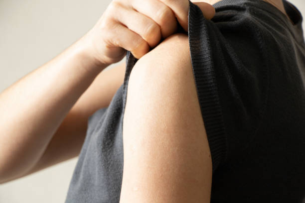 istock female shoulder on isolated light background,health 1400927278