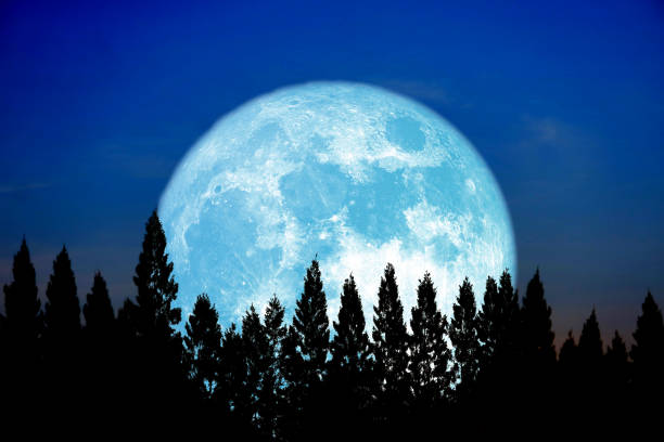 istock Full pink moon and white silhouette cloud in the night sky 1400928272