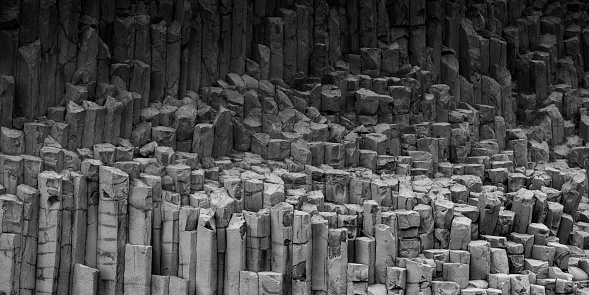 Abstract black and white image of basalt columns and pillars in Iceland.