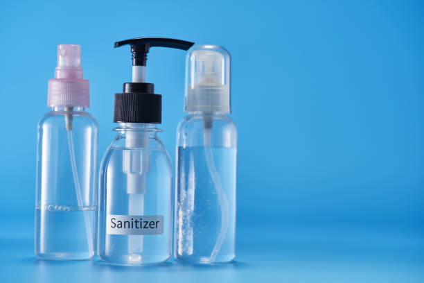 istock hand sanitizer against blue background 1400932198