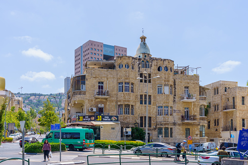 Haifa, Israel - June 02, 2022: View of various buildings, in Hadar HaCarmel neighborhood, with locals and visitors. Haifa, Northern Israel