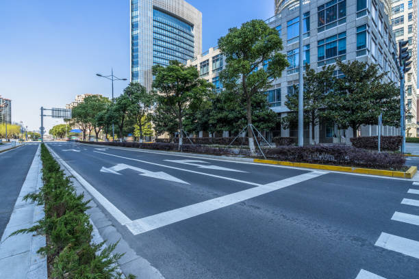 istock empty asphalt road front of modern buildings 1400944106