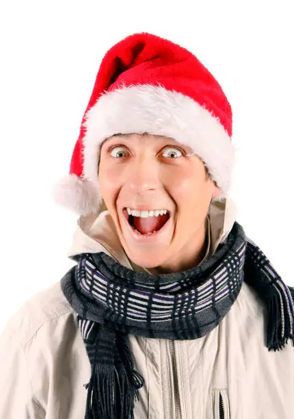 Cheerful Young Man Portrait in Santa's Hat Isolated On The White Background