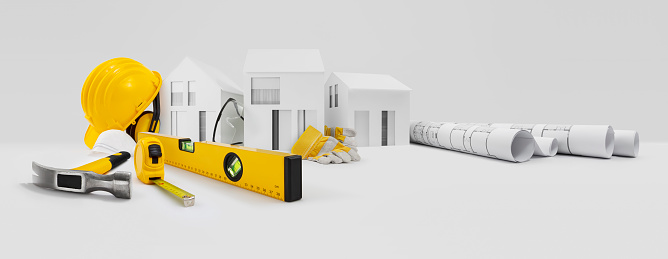 House construction plan. Work Tools for building. Architectural models houses, yellow hard hat, meter and spirit level above table with safety gloves, glasses, blueprints. Home service repair concept
