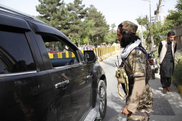 Taliban A Taliban military force security checking a civil vehicle in capital city of Kabul. militant groups stock pictures, royalty-free photos & images