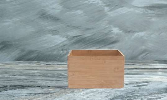 empty wooden box on marble floor. Front view
