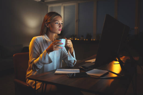 istock Young female detective working late on a case in the office 1400949977
