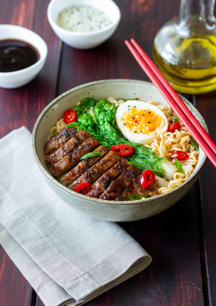istock Ramen soup with duck, noodles, cabbage, pepper and egg. Asian food. 1400955772