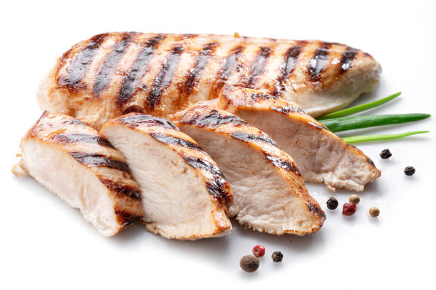 istock Grilled chicken fillet with herbs isolated on white background. 1400956247