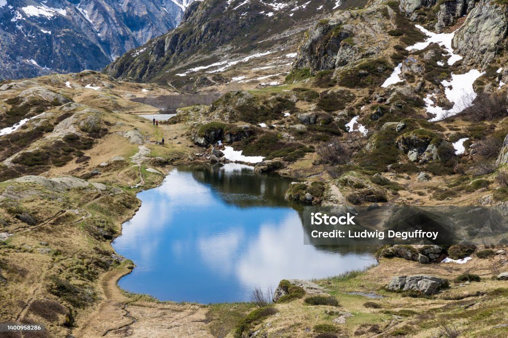 Lake Lauzon surrounded by the Cirque du Gioberney in the Massif des Écrins Beauty Stock Photo