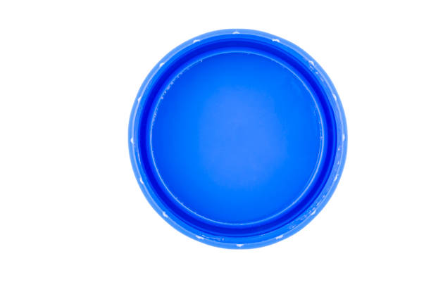 istock Plastic bottle caps isolated against a white background. Of blue color. 1400959164