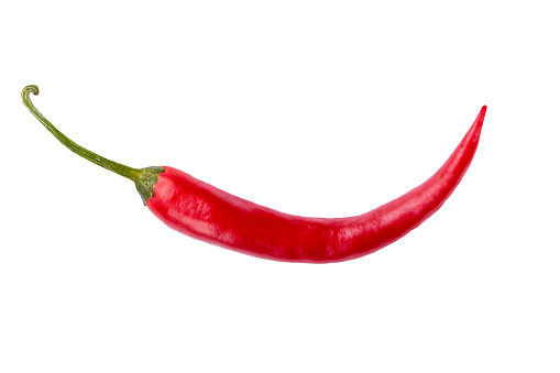 Table top view of red chili peppers in a basket with copy space