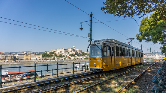 Budapest, Hungary-September 2018: Cityscape view next to the river Danube and tram trails during early morning sunny days. World city landmarks.