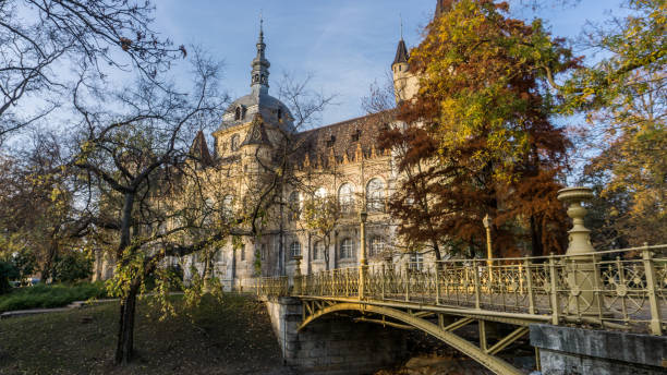 Budapest, Hungary-November 2018: Autumn scenery with the colourful environment around Vajdahunyad Castle, a famous city landmark. Beautiful architecture and historical site of the Hungarian capital in the natural environment.