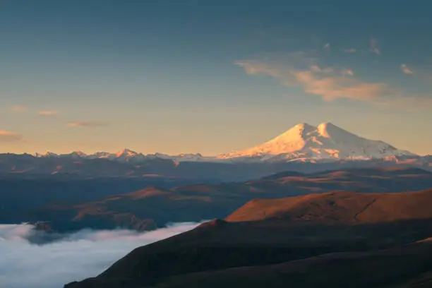 Elbrus mount at sunrise from Gil-Su valley in North Caucasus, Russia. Beautiful autumn landscape