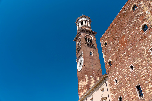 A seagull flies past the leaning bell tower of the Campanile of San Giorgio dei Greci, in Venice, Italy. This is one of 10 leaning towers in the whole of Italy.